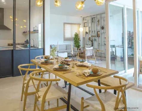 Modern and elegantly furnished dining area inside a luxury apartment at Godrej Vanantara.