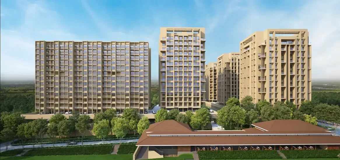 High-rise residential towers of Godrej Vanantara surrounded by expansive greenery and forest views in South Bangalore.